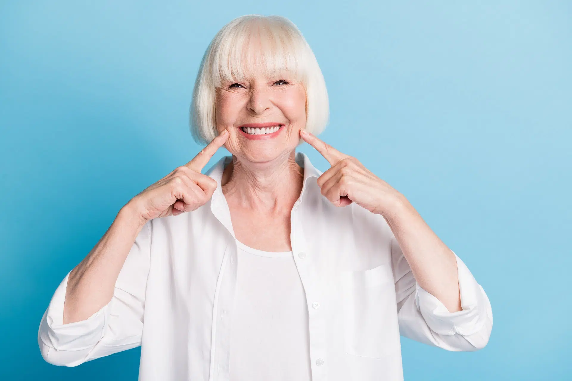 Blonde woman smiling with veneers